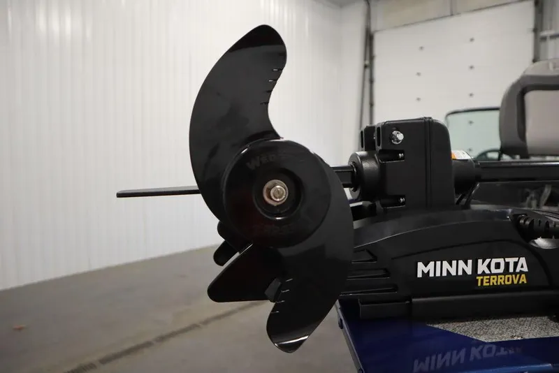 Slide: The Image of Minn Kota Terrova motor on 2025 Lowe 1775 FM WT boat in a garage. - 11