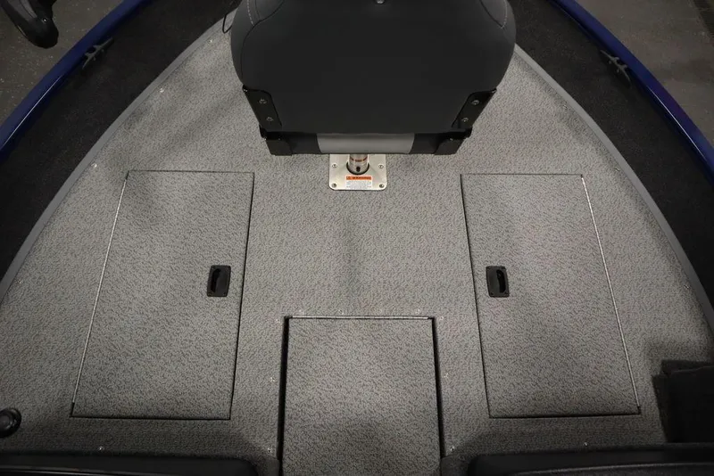 Slide: The Image of 2025 Lowe 1775 FM WT boat interior with storage compartments and seating. - 15