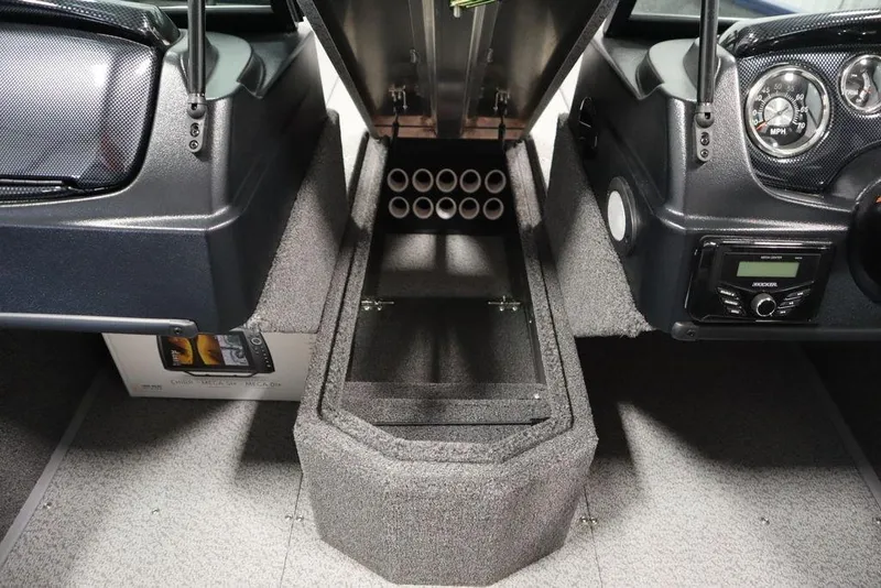 Slide: The Image of 2025 Lowe 1775 FM WT boat interior with storage compartment and dashboard controls. - 20