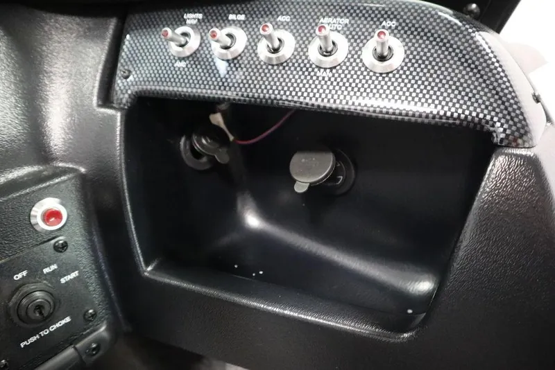 Slide: The Image of Control panel of 2025 Lowe 1775 FM WT boat with switches and ignition. - 28