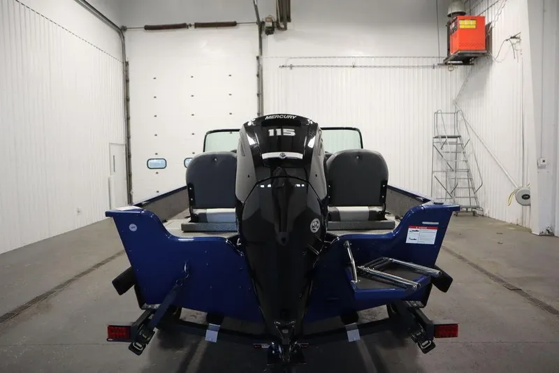 Slide: The Image of 2025 Lowe 1775 FM WT boat with Mercury 115 engine in a garage setting. - 3