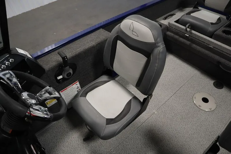 Slide: The Image of 2025 Lowe 1775 FM WT boat interior with steering wheel and cushioned seat. - 32