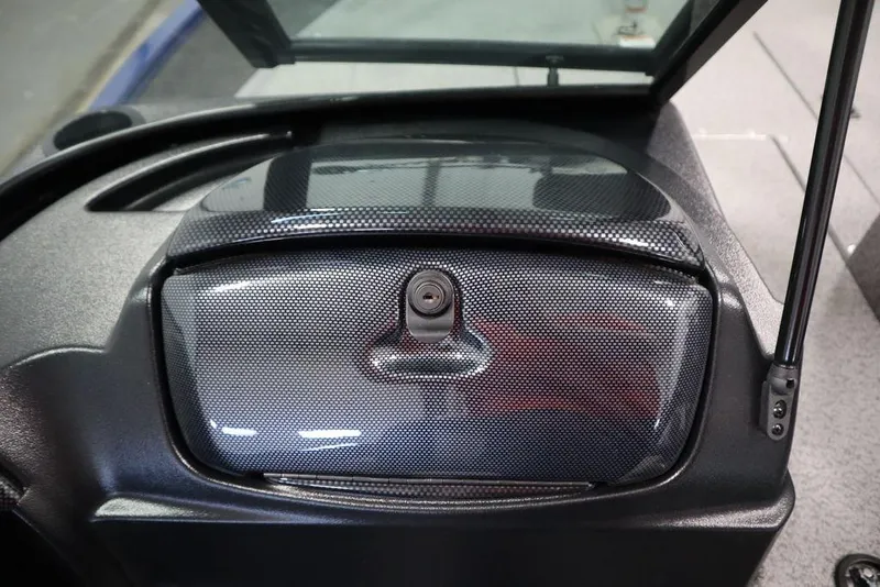 Slide: The Image of 2025 Lowe 1775 FM WT boat dashboard with carbon fiber finish and storage compartment. - 33