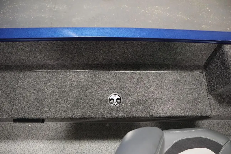 Slide: The Image of Interior view of 2025 Lowe 1775 FM WT boat, featuring carpeted flooring and storage compartment. - 35