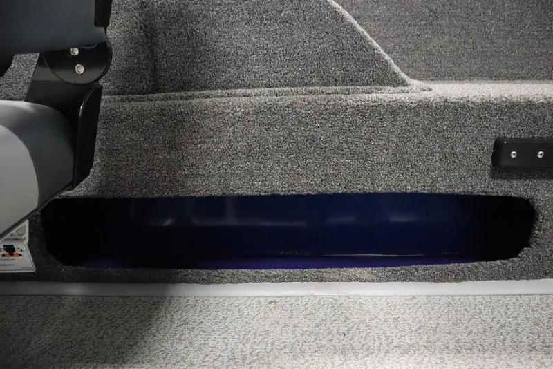 Slide: The Image of Interior view of 2025 Lowe 1775 FM WT boat, featuring carpeted storage compartment. - 36