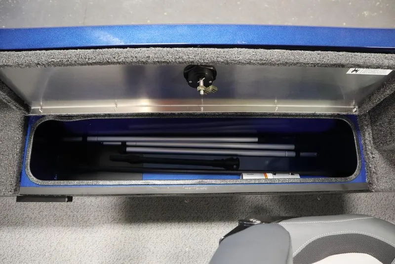 Slide: The Image of 2025 Lowe 1775 FM WT boat storage compartment with fishing rod holders. - 37