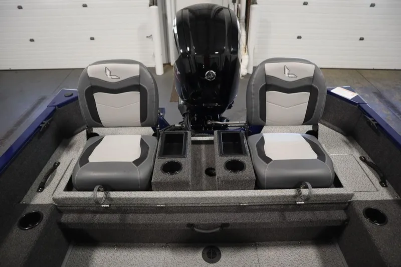 Slide: The Image of 2025 Lowe 1775 FM WT boat interior with dual seats and motor, showcasing modern design. - 39