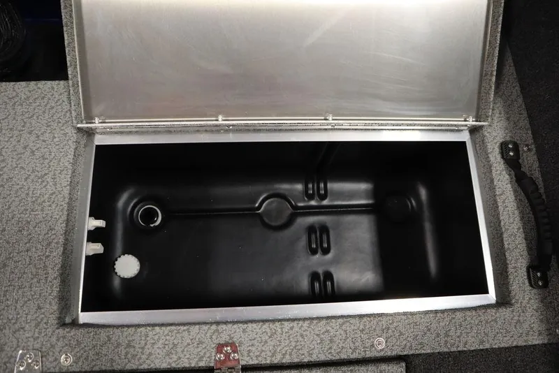 Slide: The Image of Open storage compartment in a 2025 Lowe 1775 FM WT boat. - 42