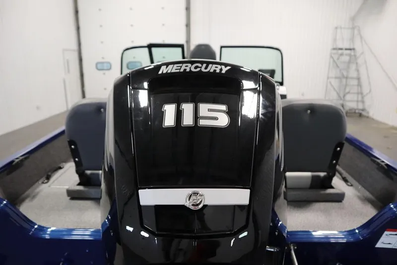 Slide: The Image of 2025 Lowe 1775 FM WT boat with Mercury 115 engine in a garage setting. - 48