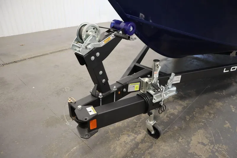 Slide: The Image of 2025 Lowe 1775 FM WT boat trailer hitch and winch system in a garage setting. - 49