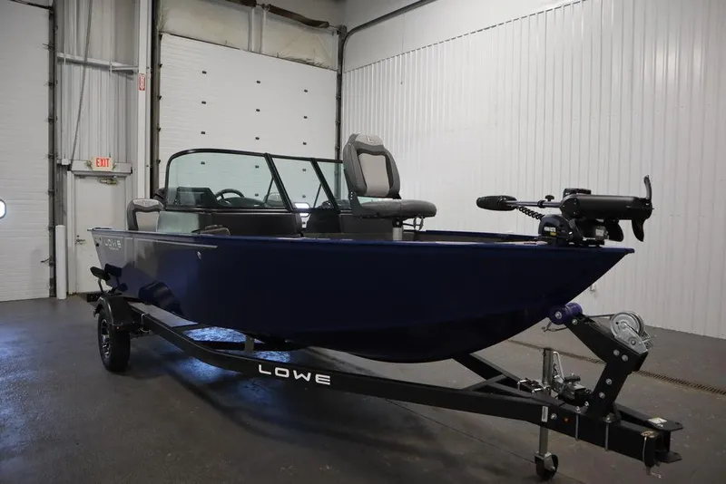 Slide: The Image of 2025 Lowe 1775 FM WT boat on trailer in indoor storage facility. - 8