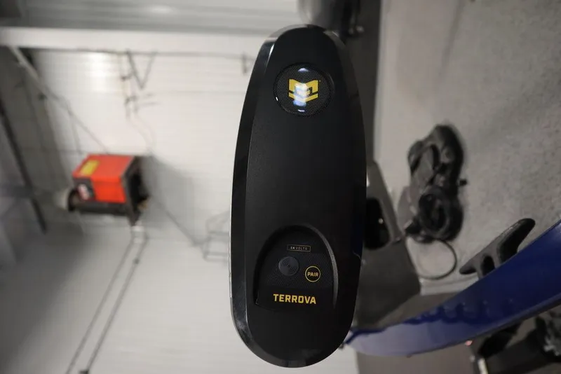Slide: The Image of 2025 Lowe 1775 FM WT boat with Terrova trolling motor in a garage setting. - 9