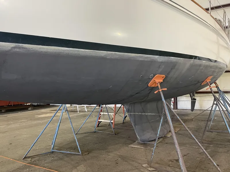 Slide: The Image of Fantasi 44 Pilot House 2003 sailboat hull on stands in a boatyard. - 13