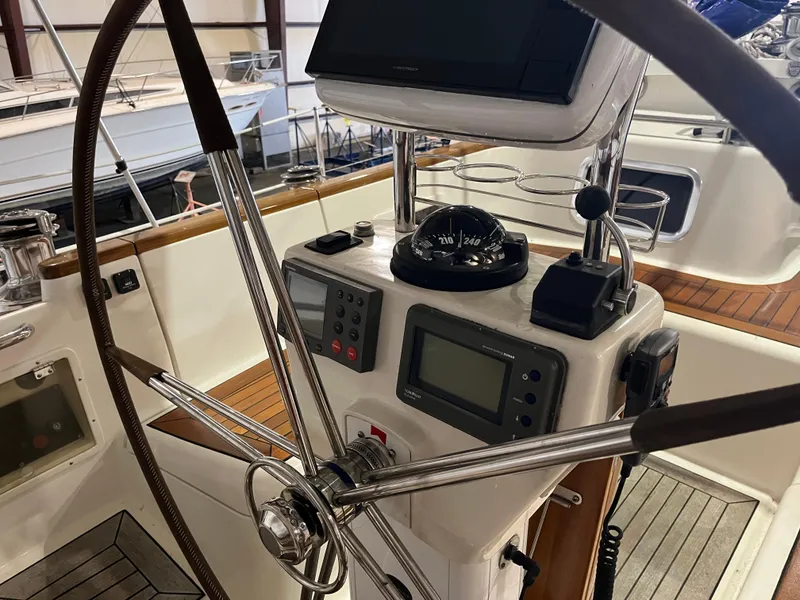 Slide: The Image of Steering wheel and navigation instruments on 2003 Fantasi 44 Pilot House yacht. - 25