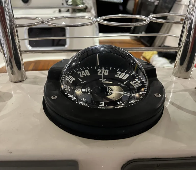 Slide: The Image of Compass on 2003 Fantasi 44 Pilot House yacht, showing navigation details. - 27