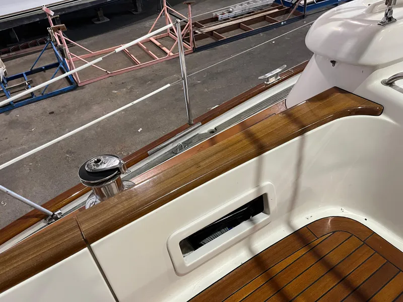 Slide: The Image of Fantasi 44 Pilot House 2003 yacht deck with wooden trim and winch. - 34