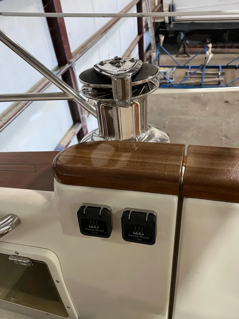 Slide: The Image of 2003 Fantasi 44 Pilot House yacht deck with winch and controls. - 36