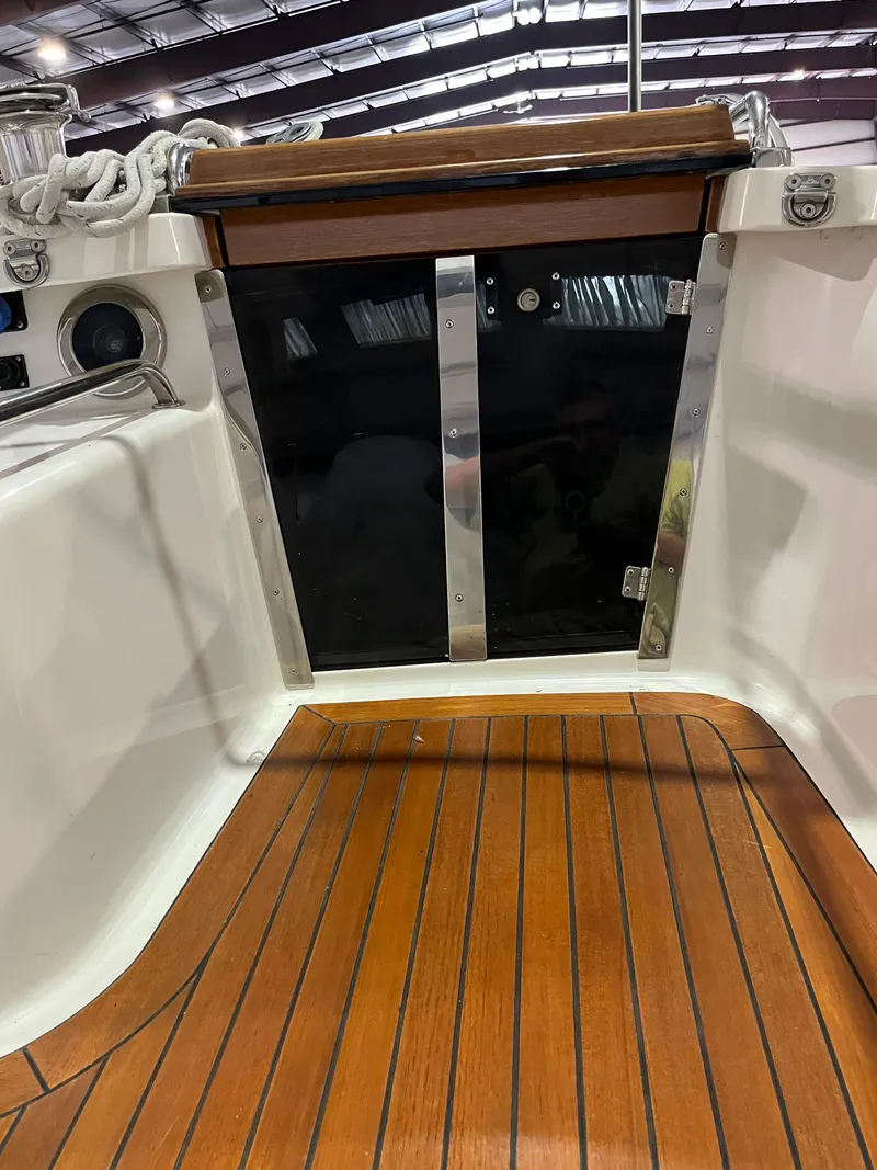 Slide: The Image of Fantasi 44 Pilot House 2003 yacht interior with wooden flooring and sleek design. - 38