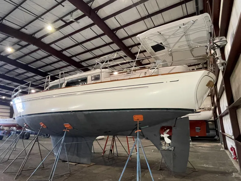 Slide: The Image of 2003 Fantasi 44 Pilot House sailboat in indoor storage on stands. - 4
