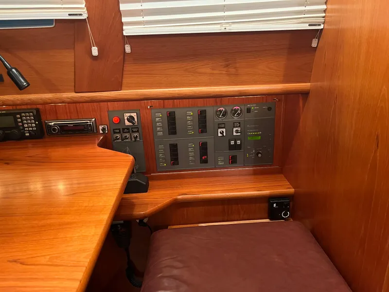 Slide: The Image of Control panel in a 2003 Fantasi 44 Pilot House yacht with wooden interior. - 45