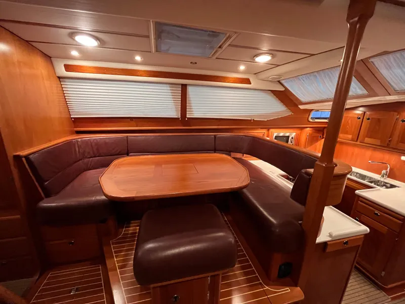 Slide: The Image of Luxurious interior of 2003 Fantasi 44 Pilot House yacht with elegant wood finish. - 47