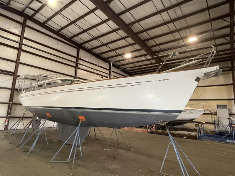 Slide: The Image of 2003 Fantasi 44 Pilot House sailboat in indoor storage on stands. - 8