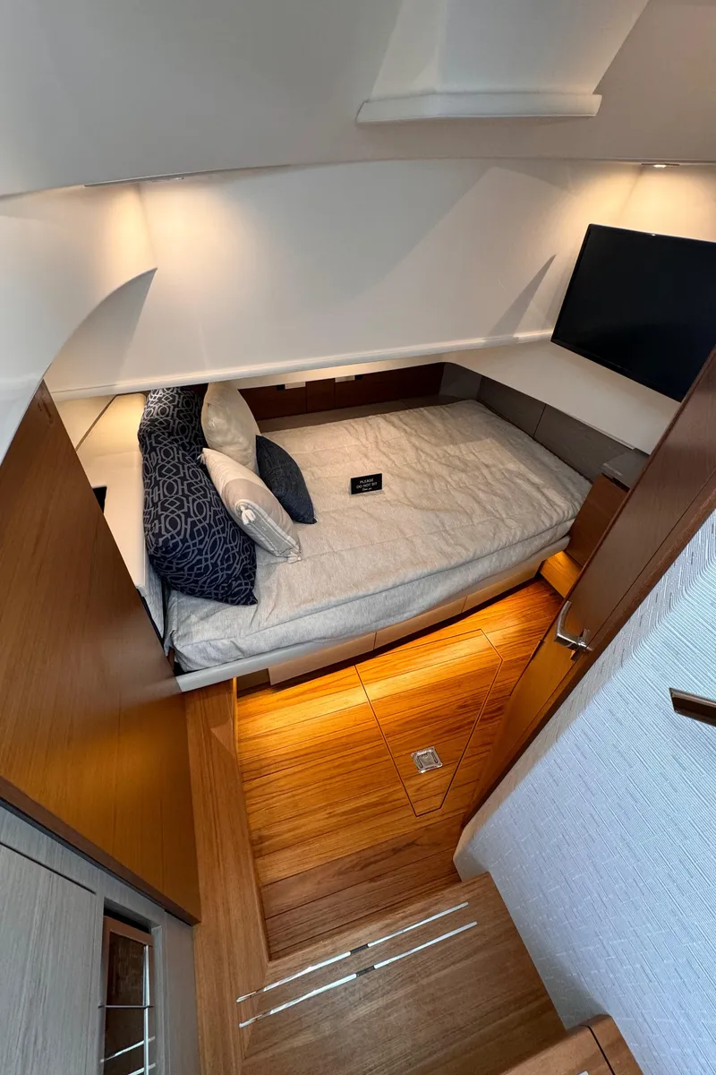 Slide: The Image of Interior cabin of 2023 Tiara Yachts 38 LS with bed and TV. - 13