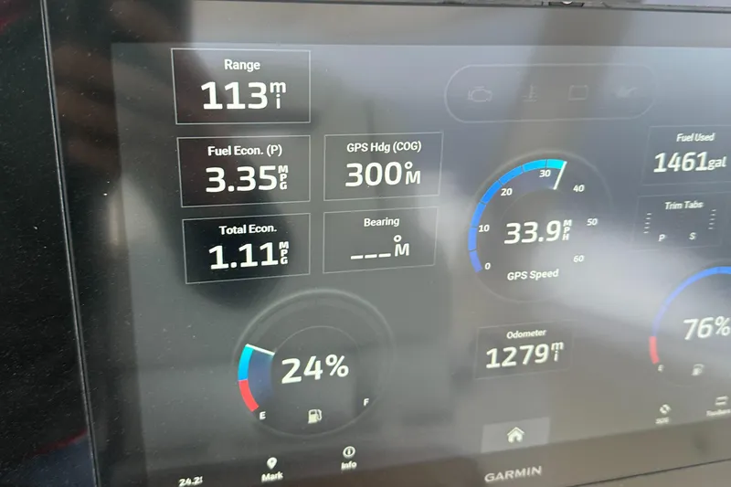 Slide: The Image of Dashboard display of 2023 Tiara Yachts 38 LS showing range, fuel economy, and GPS data. - 18