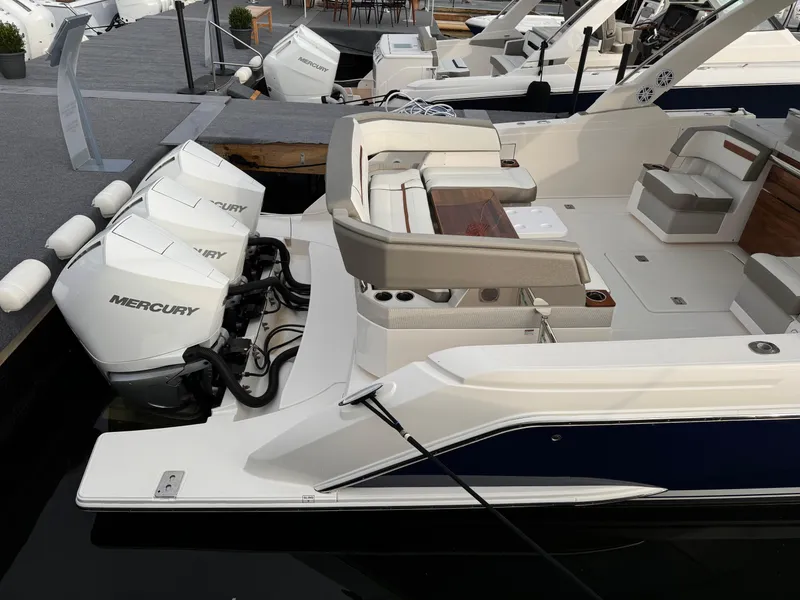 Slide: The Image of 2023 Tiara Yachts 38 LS with triple Mercury engines docked at marina. - 6
