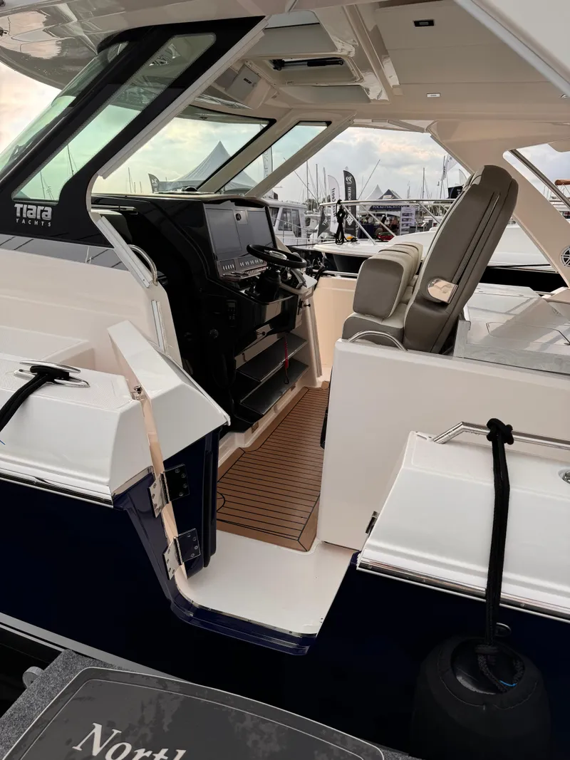 Slide: The Image of 2023 Tiara Yachts 38 LS interior with modern helm and seating. - 7
