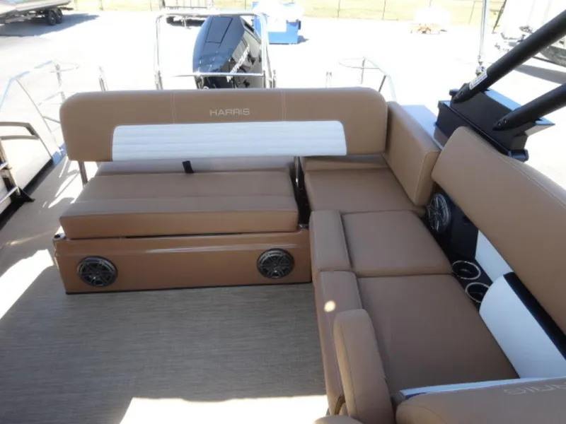 Slide: The Image of 2025 Harris Solstice 250 boat interior with tan seating and built-in speakers. - 11