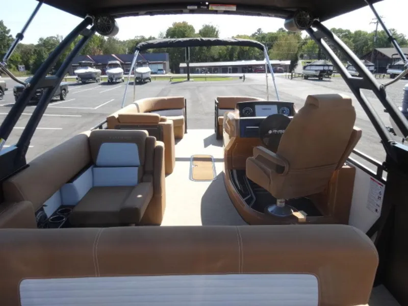 Slide: The Image of 2025 Harris Solstice 250 boat interior with luxurious seating and modern dashboard. - 17