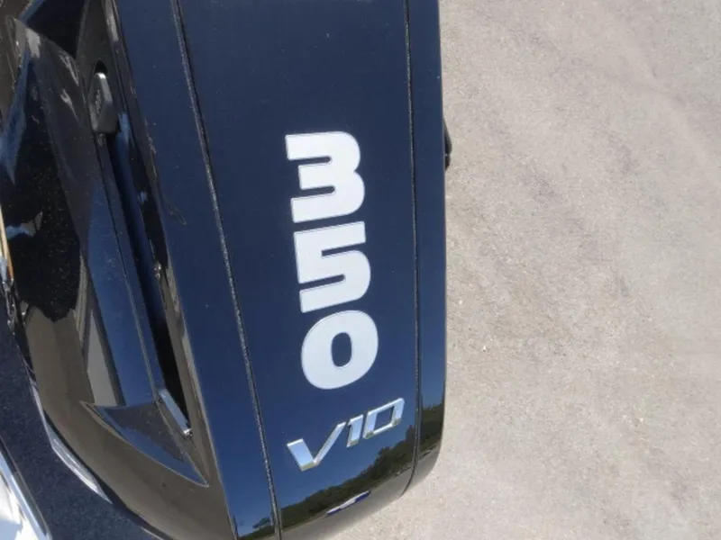 Slide: The Image of Close-up of 2025 Harris Solstice 250 V10 engine cover with '350' marking. - 18