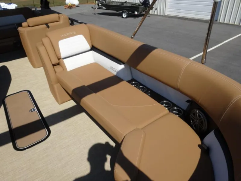 Slide: The Image of 2025 Harris Solstice 250 boat interior with tan seating and cup holders. - 5