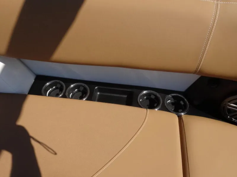 Slide: The Image of 2025 Harris Solstice 250 interior with tan seating and cup holders. - 6