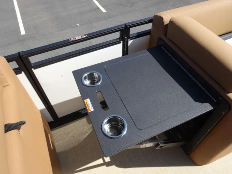 Slide: The Image of 2025 Harris Solstice 250 boat interior with foldable table and cup holders. - 8