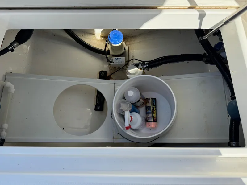 Slide: The Image of 2017 Regulator 25 CC storage compartment with maintenance supplies and equipment. - 18