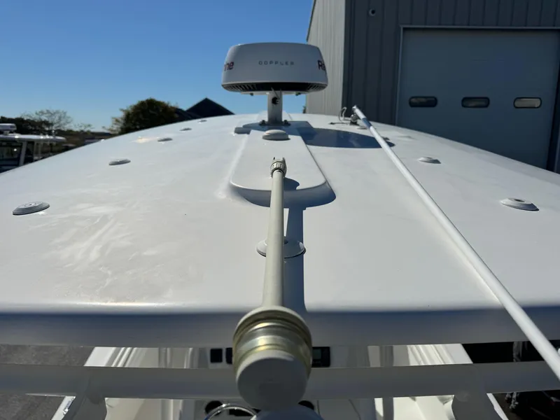 Slide: The Image of 2017 Regulator 25 CC boat with radar and antenna on deck. - 23