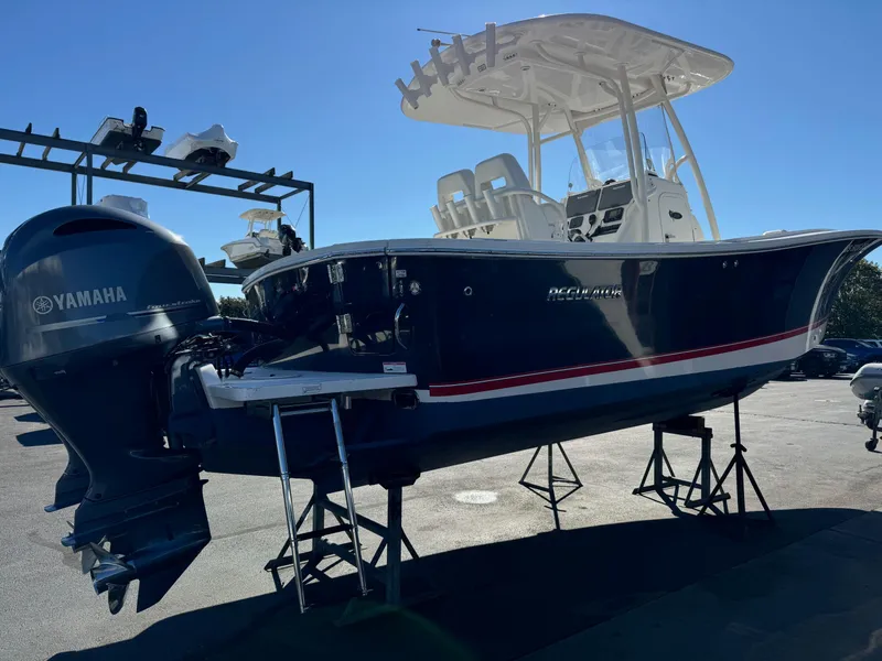 Slide: The Image of 2017 Regulator 25 CC boat with Yamaha outboard engine on display stand. - 4