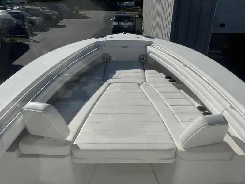 Slide: The Image of 2017 Regulator 25 CC boat with spacious white seating area. - 8