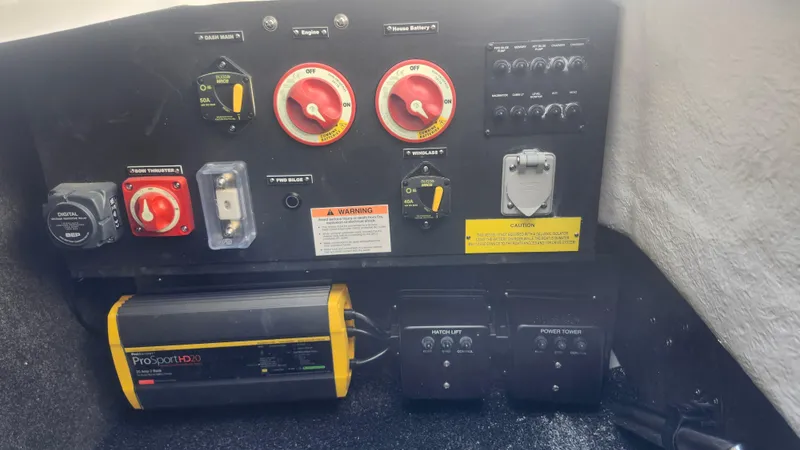 Slide: The Image of Control panel of 2025 Regal LX6 boat with various switches and indicators. - 10