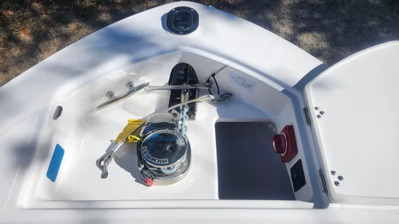 Slide: The Image of Anchor compartment of 2025 Regal LX6 boat with winch and chain. - 19