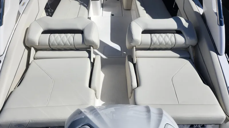 Slide: The Image of 2025 Regal LX6 boat interior with luxurious white seating and modern design. - 4