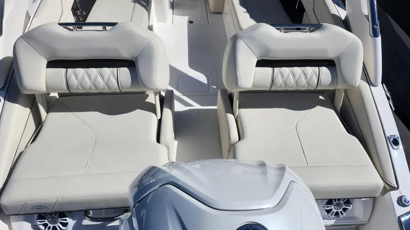 Slide: The Image of Luxurious seating on 2025 Regal LX6 boat, featuring elegant white upholstery. - 6