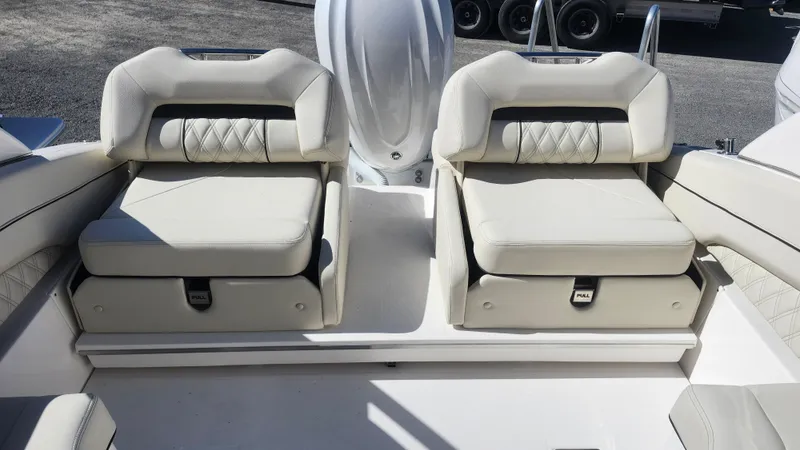 Slide: The Image of 2025 Regal LX6 boat interior with luxurious white seating and modern design. - 7