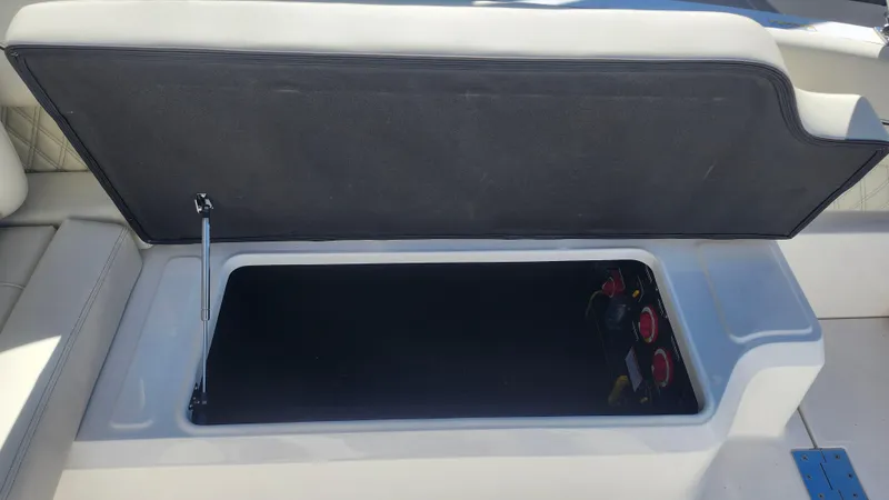 Slide: The Image of Open storage compartment on 2025 Regal LX6 boat. - 9