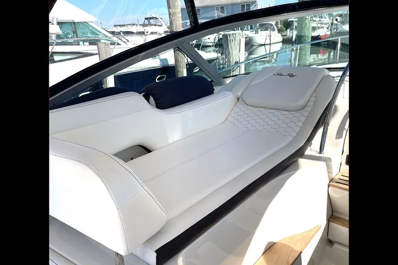 Slide: The Image of 2019 Sea Ray 350 Sundancer interior with luxurious white seating and modern design. - 10