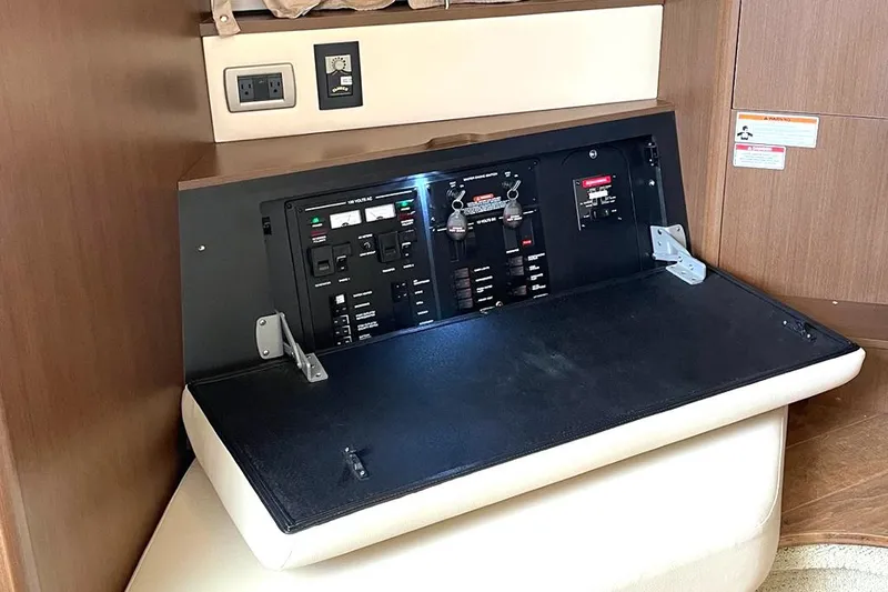 Slide: The Image of Electrical control panel inside 2019 Sea Ray 350 Sundancer yacht cabin. - 18