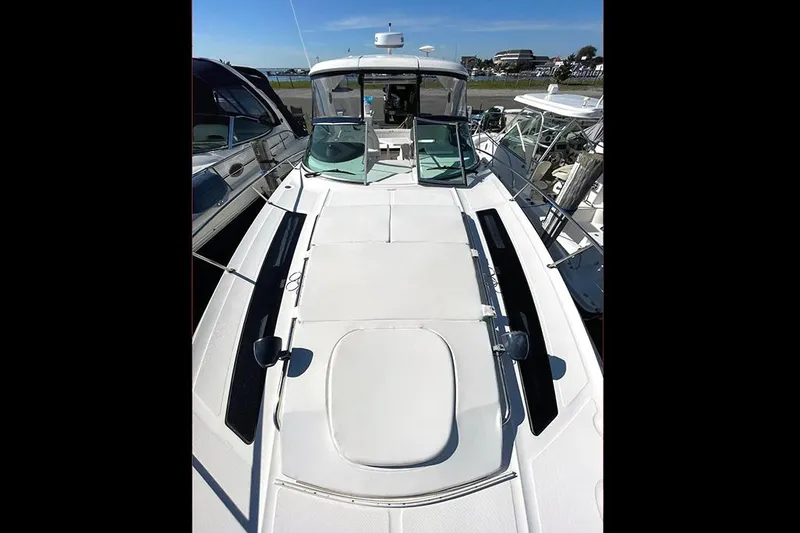 Slide: The Image of 2019 Sea Ray 350 Sundancer yacht with sleek deck design, docked at marina. - 3