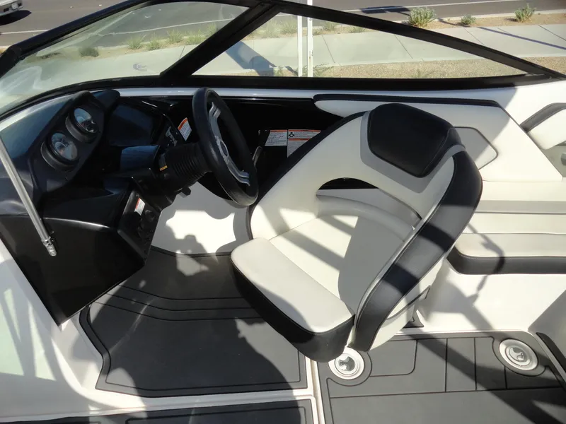 Slide: The Image of 2017 Yamaha AR195 boat interior with steering wheel and seating. - 11
